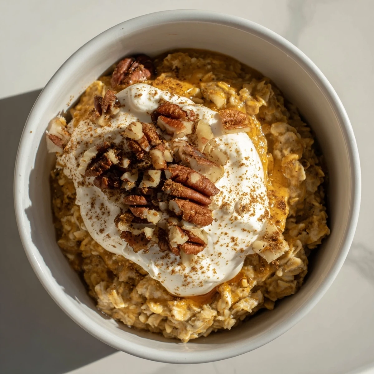 Warm, spiced Pumpkin Spice Latte Oats, perfect for a cozy fall breakfast, served in a bowl.