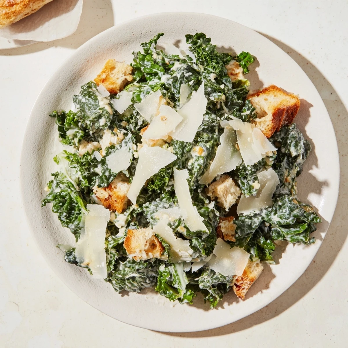 A creamy homemade dressing coats this flavorful Kale Caesar Salad, perfect for a light lunch.
