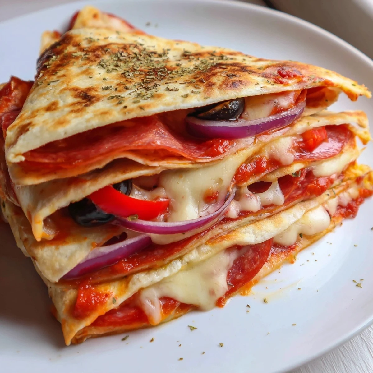 Serving suggestion of a Tortilla Pizza Wrap cut in half, paired with a side salad and marinara dipping sauce.