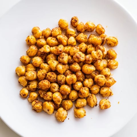 Golden, crispy Chickpea Snack, perfectly roasted with smoky paprika, ready for a satisfying, healthy bite.