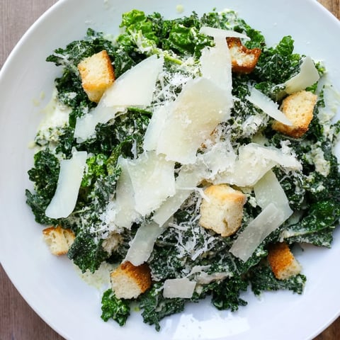 Fresh, vibrant Kale Caesar Salad with bright green kale, Parmesan, and crunchy croutons ready.