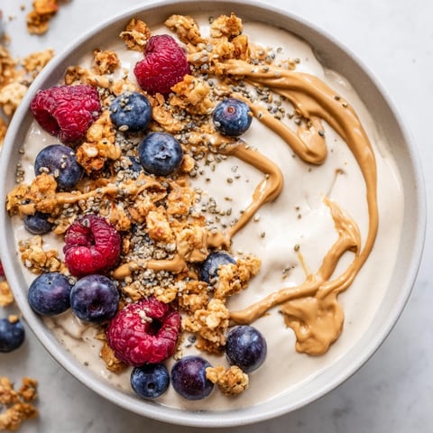 Freshly made protein ice cream bowls, a healthy dessert layered with berries and granola.