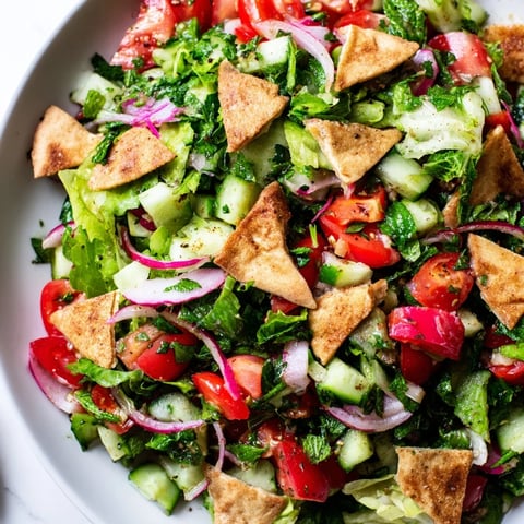 Lebanese Fattoush Salad with vibrant colors, crunchy pita chips, and a tangy sumac dressing.