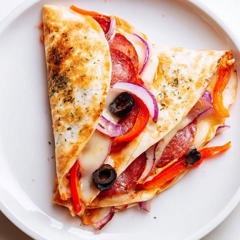 Golden crispy Tortilla Pizza Wrap slices steaming on a wooden board with melted mozzarella and colorful toppings.