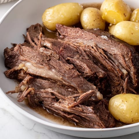 A close-up view of the simple, flavorful 4-ingredient slow cooker pot roast, ready to serve and enjoy.