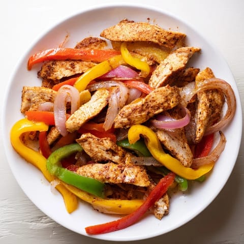 Golden brown sheet-pan chicken fajitas, bursting with flavor, perfect for a quick and easy Tex-Mex dinner.