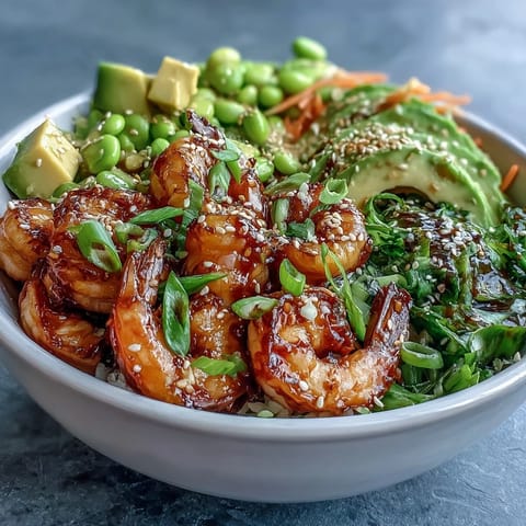 Colorful 20-Minute Shrimp Poke Bowl with mango, edamame, and sliced avocado on brown rice.