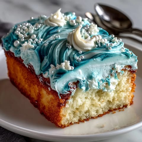 Pisces Cake Sheet Cake with ocean wave piping in blue ombré buttercream and white accents.