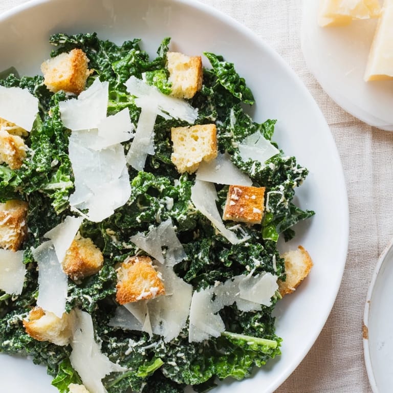 Enjoy this healthy and delicious Kale Caesar Salad featuring crispy croutons and fresh Parmesan.