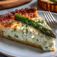 Golden Asparagus Ricotta Tart showcasing spring flavors on flaky pastry.