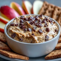Creamy Fiber-Packed Chickpea Cookie Dough Dip ready to be scooped with fruit.